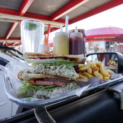 Tuna salad sandwich with fries.