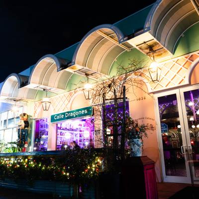 Restaurant exterior at night with illuminated facade.