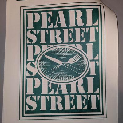 The menu with the restaurant's name on it.