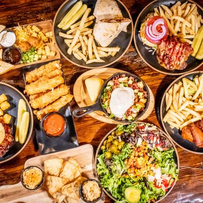 An assortment of dishes arranged on a table, overhead view.