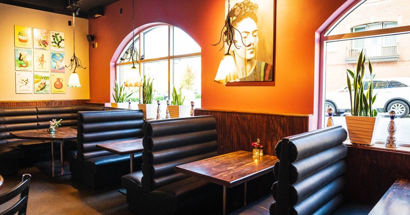 Interior, dining booths, pictures and portrait of Frida Kahlo, floral pendant lights
