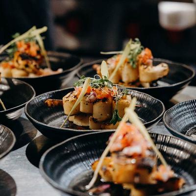 Plates of grilled seafood appetizers.