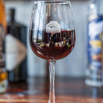 A glass of red wine.