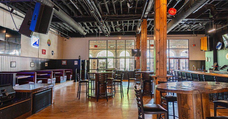 Interior, big area with high chairs and tables