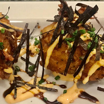 Fried dough balls with seasonings and sauce