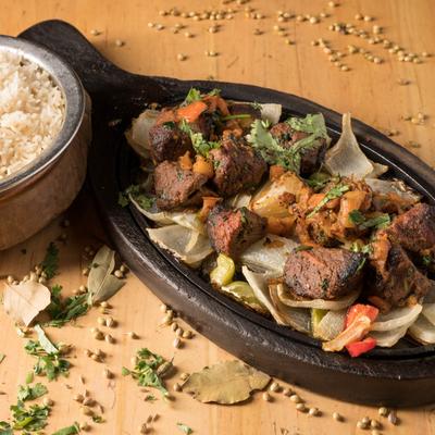 Marinated lamb with sauteed veggies.