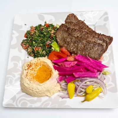 Lamb Gyro, with hummus, salad, and pickled veggies.