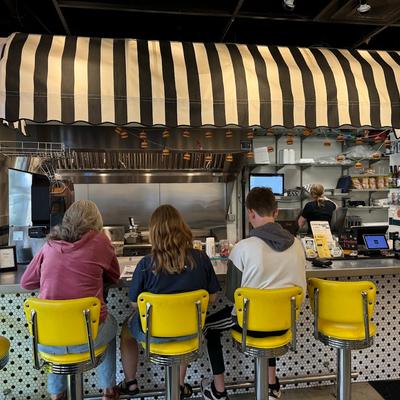 Customers sitting at the counter.