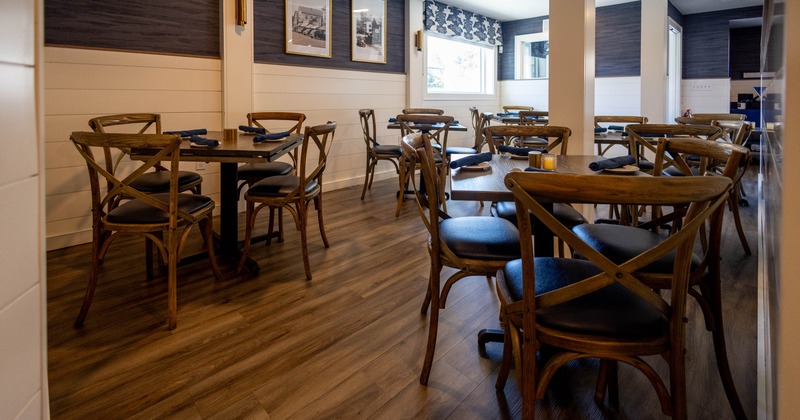 Restaurant dining area with wooden tables and chairs