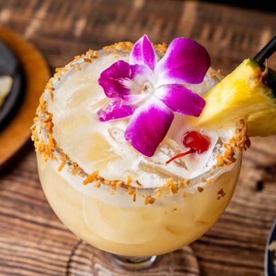 Rum, banana liqueur, pineapple, and coconut cream cocktail.