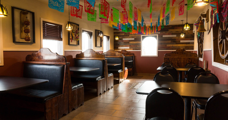 Interior, seating area with booths and guest tables