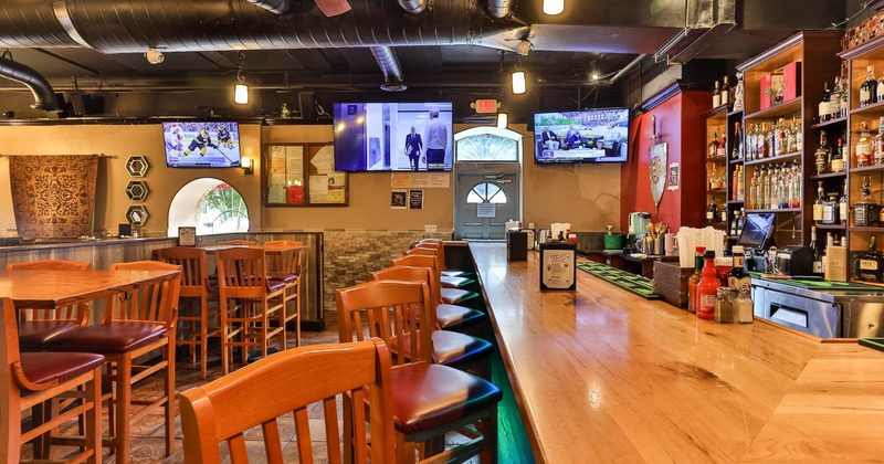 Interior, bar area, bar and lined up bar stools