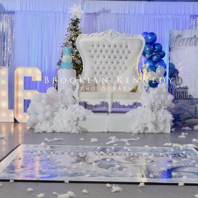 White throne chair with blue decorations.
