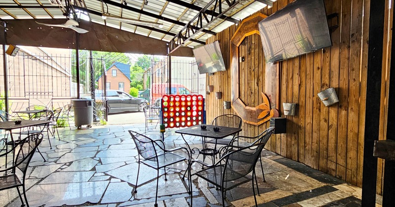 Covered patio with tables and seating