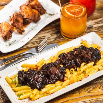 Chicken wings, Rasta Pasta,  charred orange whiskey and cherry lemonade