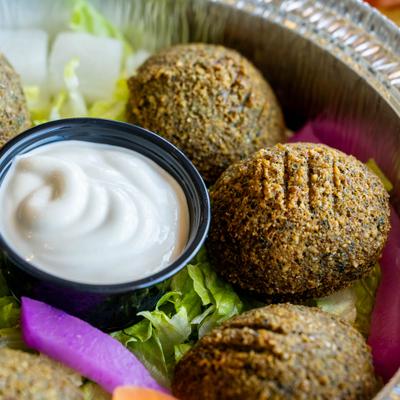 Falafel with dipping sauce.