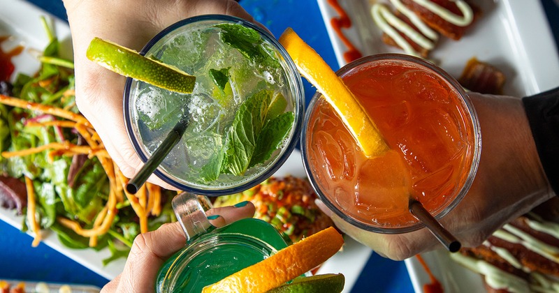 Customers toasting with drinks