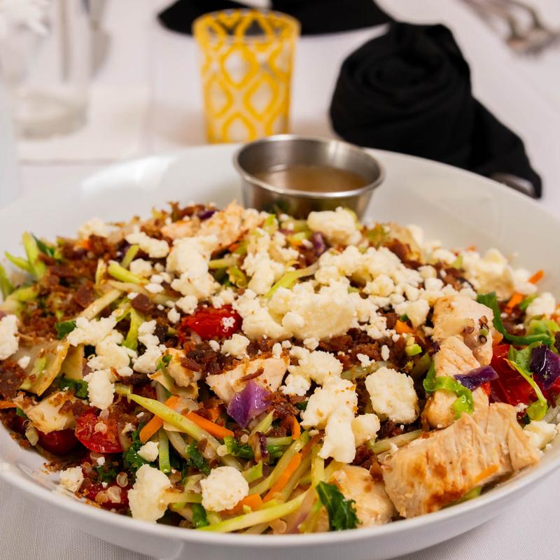 Power MIx: Sauté of Kale, Cabbage, Radicchio & Brussels Sprouts with Chicken Breast, Artichoke Hearts, Grape Tomatoes, Quinoa & Red Onion, Topped with Turkey Bacon & Feta photo