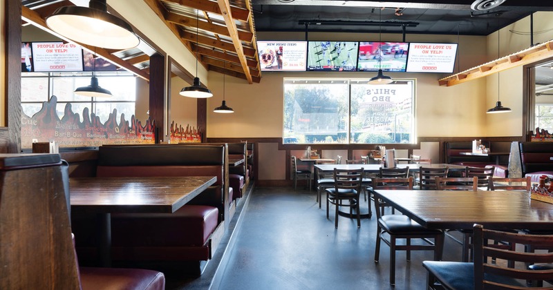 Interior, tables, chairs, booths, windows, LED screens, lights