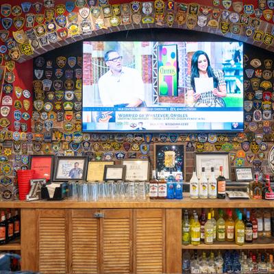Bar, drink rack, tv screen.