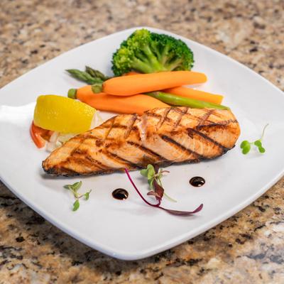 Grilled Salmon served with veggies.