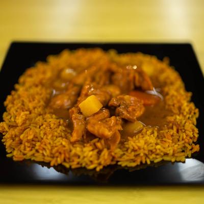 Curry chicken woth vegetables, served over rice.