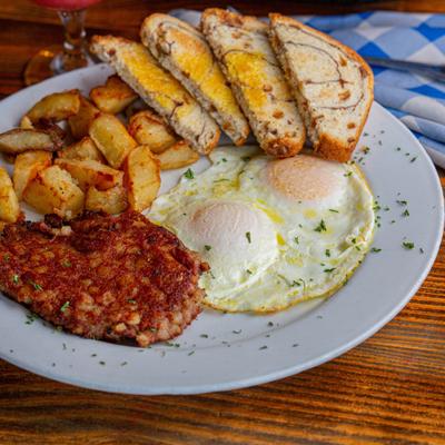 Two Eggs and Corned Beef Hash, served with roasted potatoes and toast