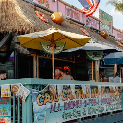Exterior shot of the patio with umbrellas and lime shaped pinatas