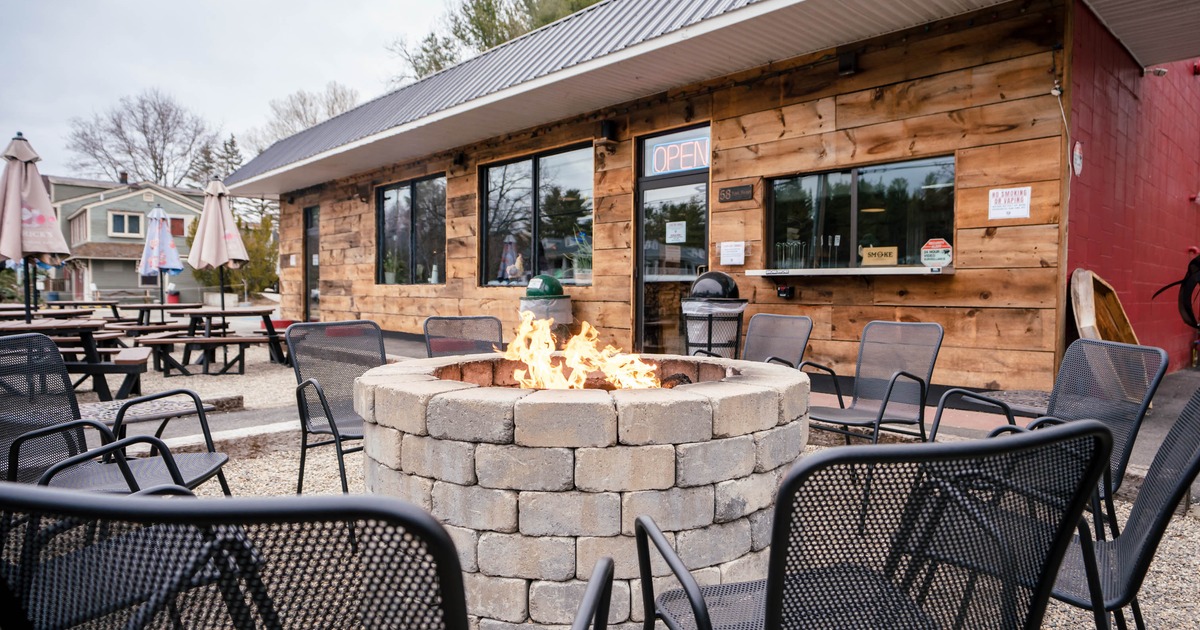 Outdoor seating area with a fire pit and chairs