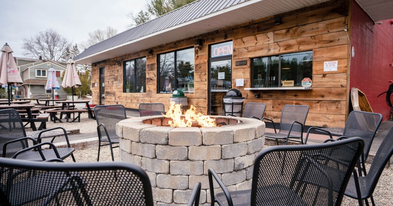 Outdoor seating area with a fire pit and chairs