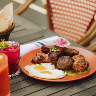 Food and drinks on a table outside.