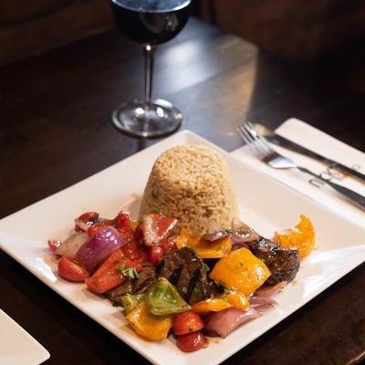 Grilled meat and vegetables, served with rice.
