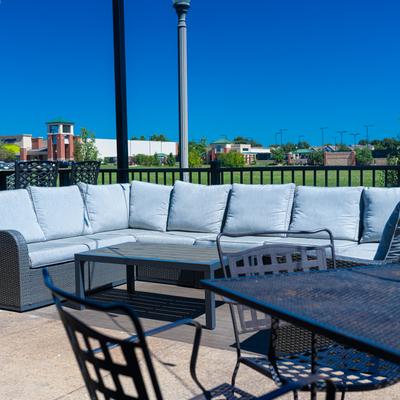 Exterior, garden, couch, table, chairs.