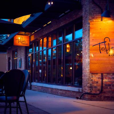 Tables and chairs outside on the patio.