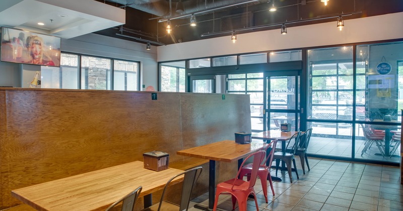 Interior, dining area, wooden banquette bench with tables and chairs