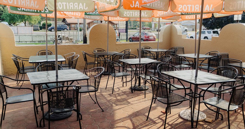 Exterior, patio, seating area with parasols