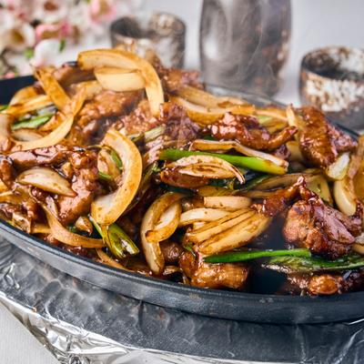 Stir fried beef with onions and peppers.