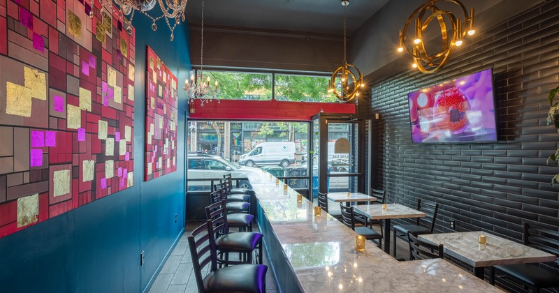 Interior, long counter, tables and chairs