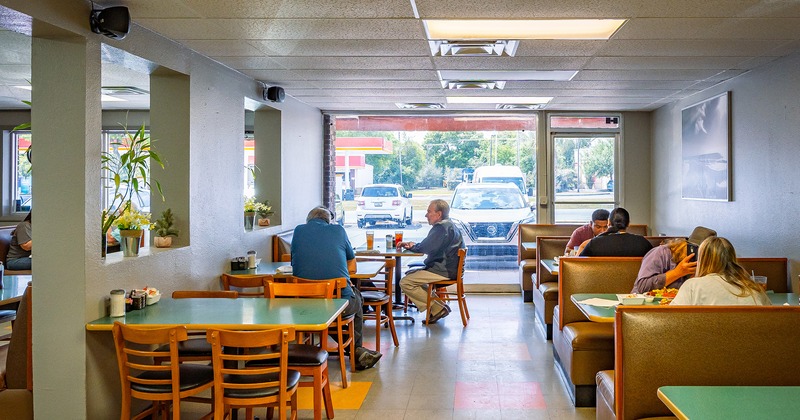 Interior, dining area with guests enjoying their food and drinks