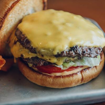 A closeup on a cheeseburger.