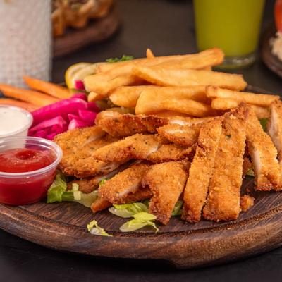 Cream Chop Chicken plate with fries, pickled vegetables, and dipping sauces.