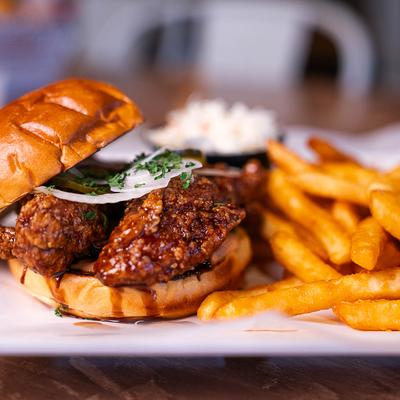 Soy chicken sandwich served with fries.
