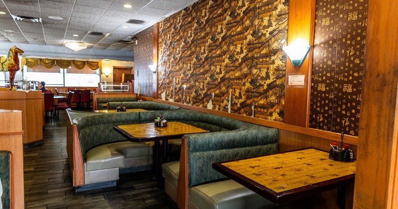 Cozy interior seating area with upholstered booths