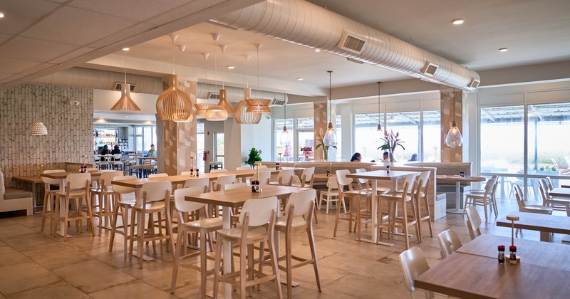 Interior, seating area with bar tables and bar chairs