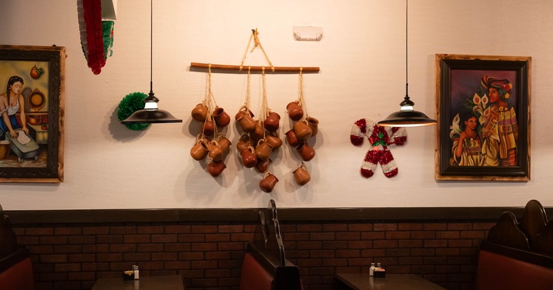 Interior, booths ready for guests with decorations on the wall