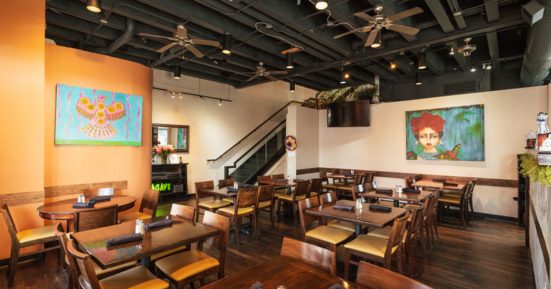 Colorful pictures on the walls, spacious dining area