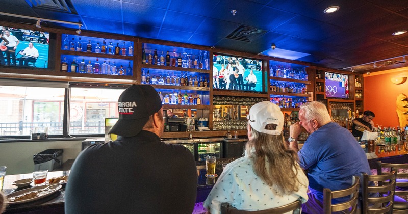 Customers sitting at the bar