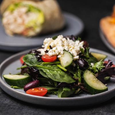 Greek salad with cucumbers, olives, cherry tomatoes and feta.