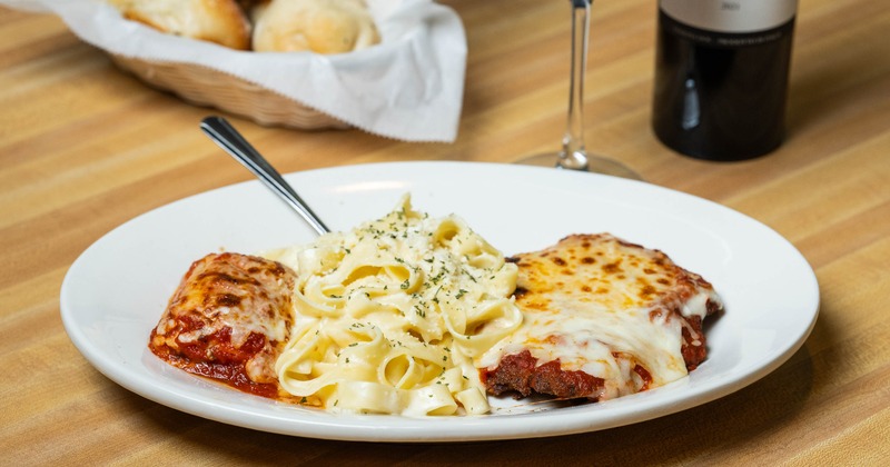 Italian trio pasta dishes served with wine and bread
