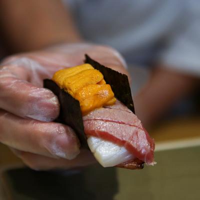 A hand holding a Tatsuda special.